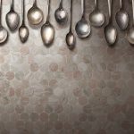 Old vintage spoons on stone table
